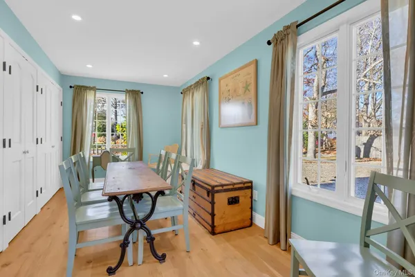 a view of a livingroom with furniture and a window