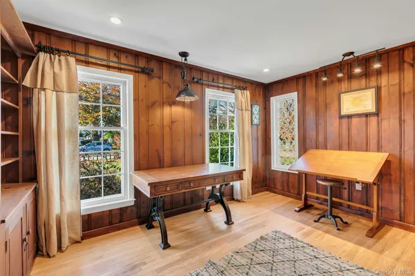 a area with wooden floor and furniture