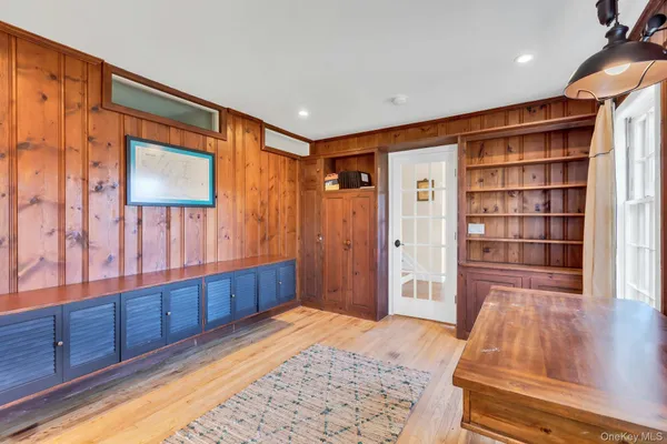 a bathroom with a sink mirror and toilet