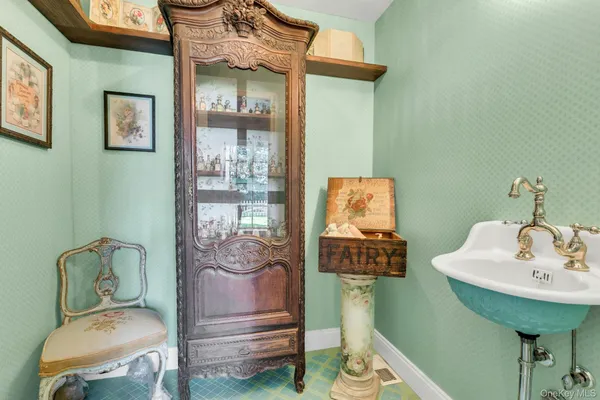 a bedroom with furniture and a large window