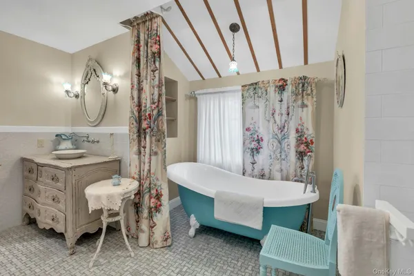 a white toilet sitting next to a bathroom sink