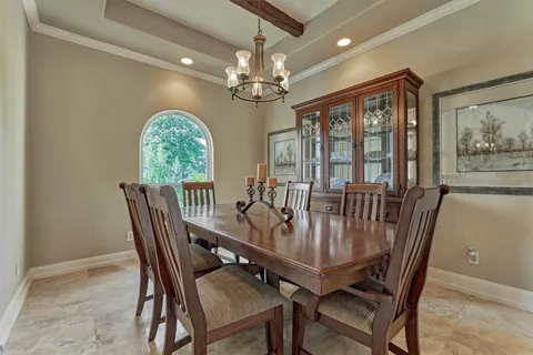 a large kitchen with kitchen island a sink a stove and cabinets