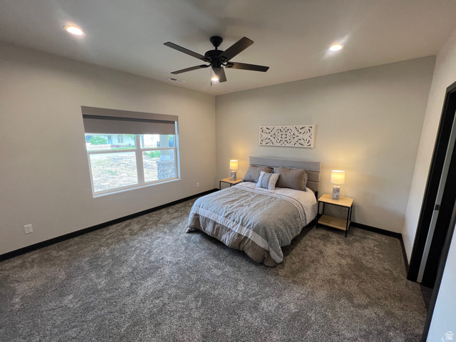 160 200 West Henefer, UT 84033 - Photo 20 of 25 Carpeted room featuring a ceiling fan, recessed lighting, and a large window with a roller shade