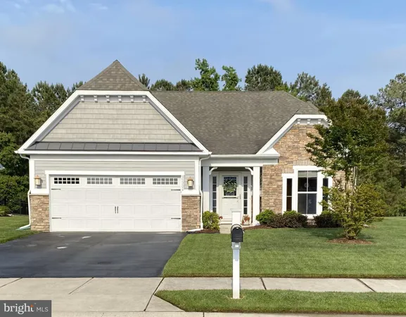 a view of a white house with a yard
