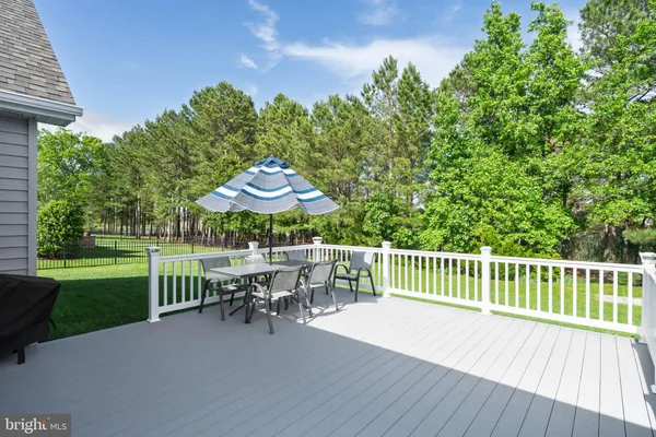 a patio with table and chairs