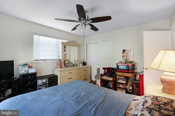 a bed room with a bed and a television