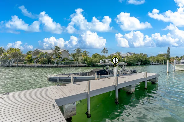 a view of a lake with couches in the patio