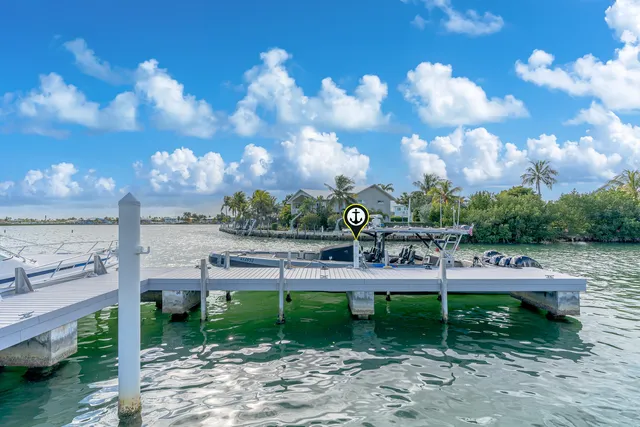 a view of a big yard with table and chairs