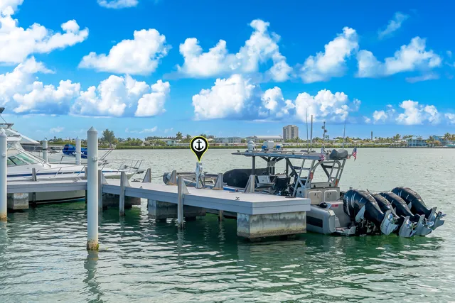 an aerial view of a house with outdoor space and a lake view