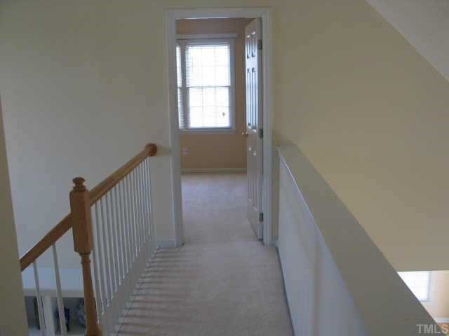 5205 Denmead Way Raleigh, NC 27613 - Photo 11 of 12 View of catwalk upstairs leading to one of the bedrooms.