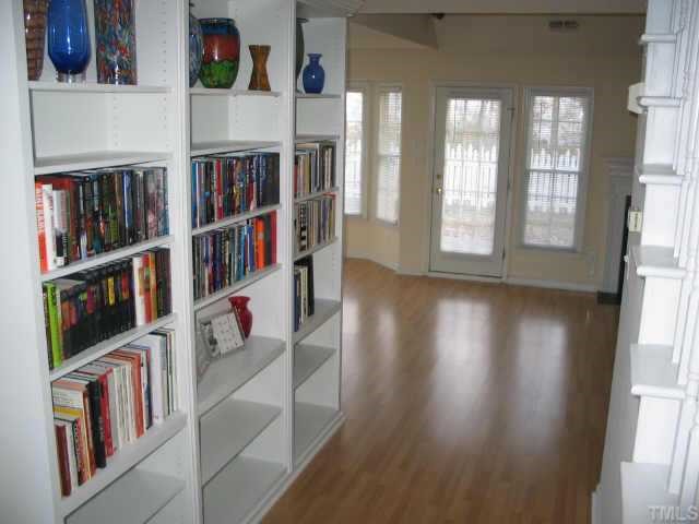 5205 Denmead Way Raleigh, NC 27613 - Photo 5 of 12 Entrance hall has beautiful built in bookshelves.