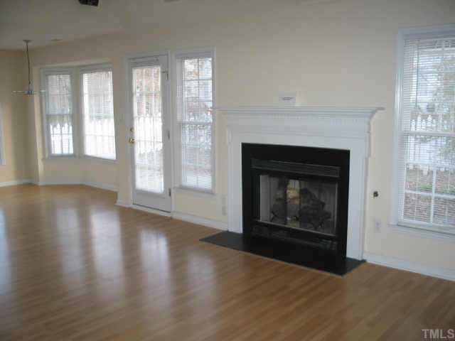 5205 Denmead Way Raleigh, NC 27613 - Photo 7 of 12 View of family room leading into breakfast nook with bay window