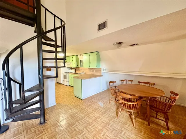 a view of a living room and bathroom