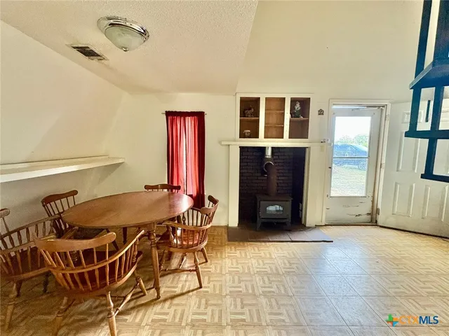 a kitchen with stainless steel appliances granite countertop a sink and a refrigerator