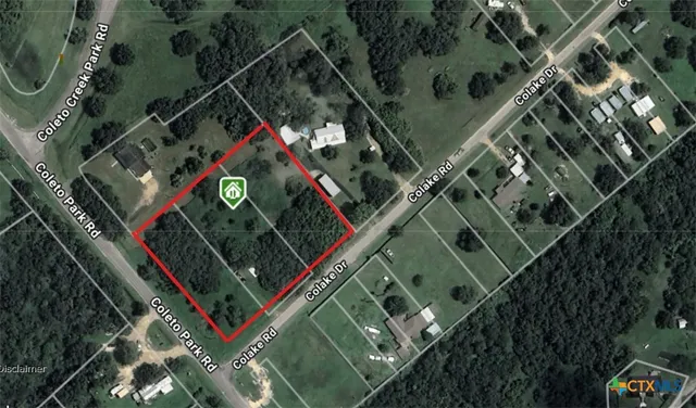 a view of empty area with large trees