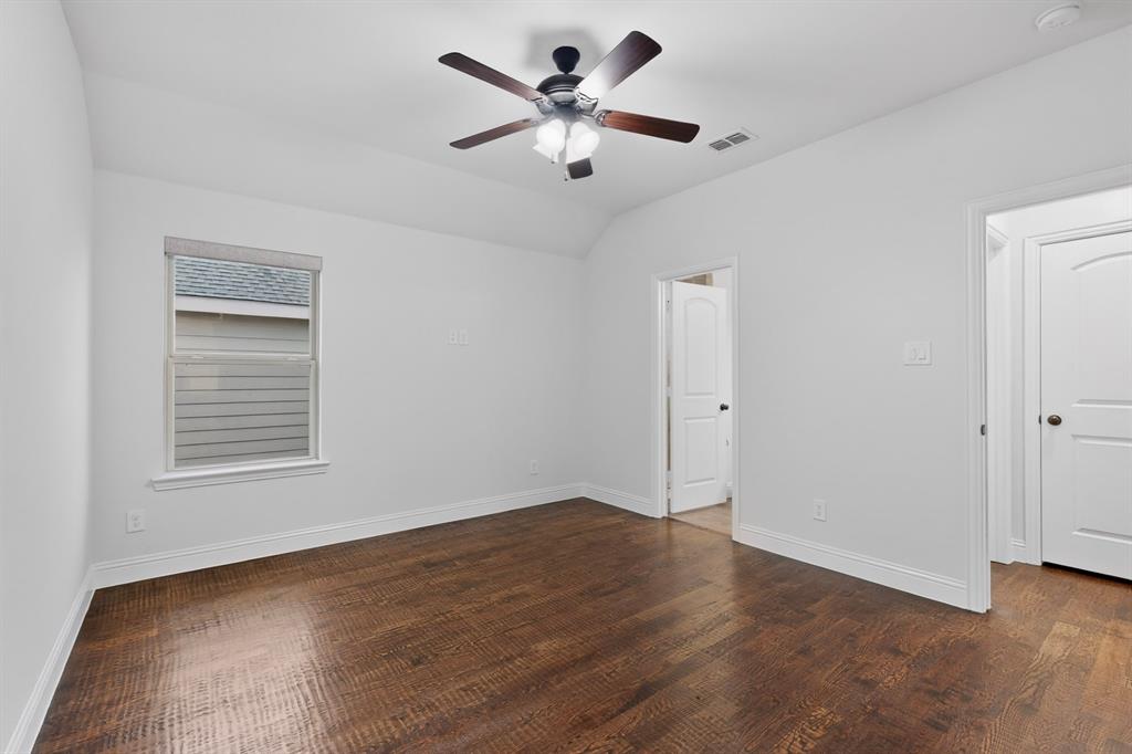 2313 Windjammer Way Rowlett, TX 75088 - Photo 26 of 38 an empty room with fan and windows