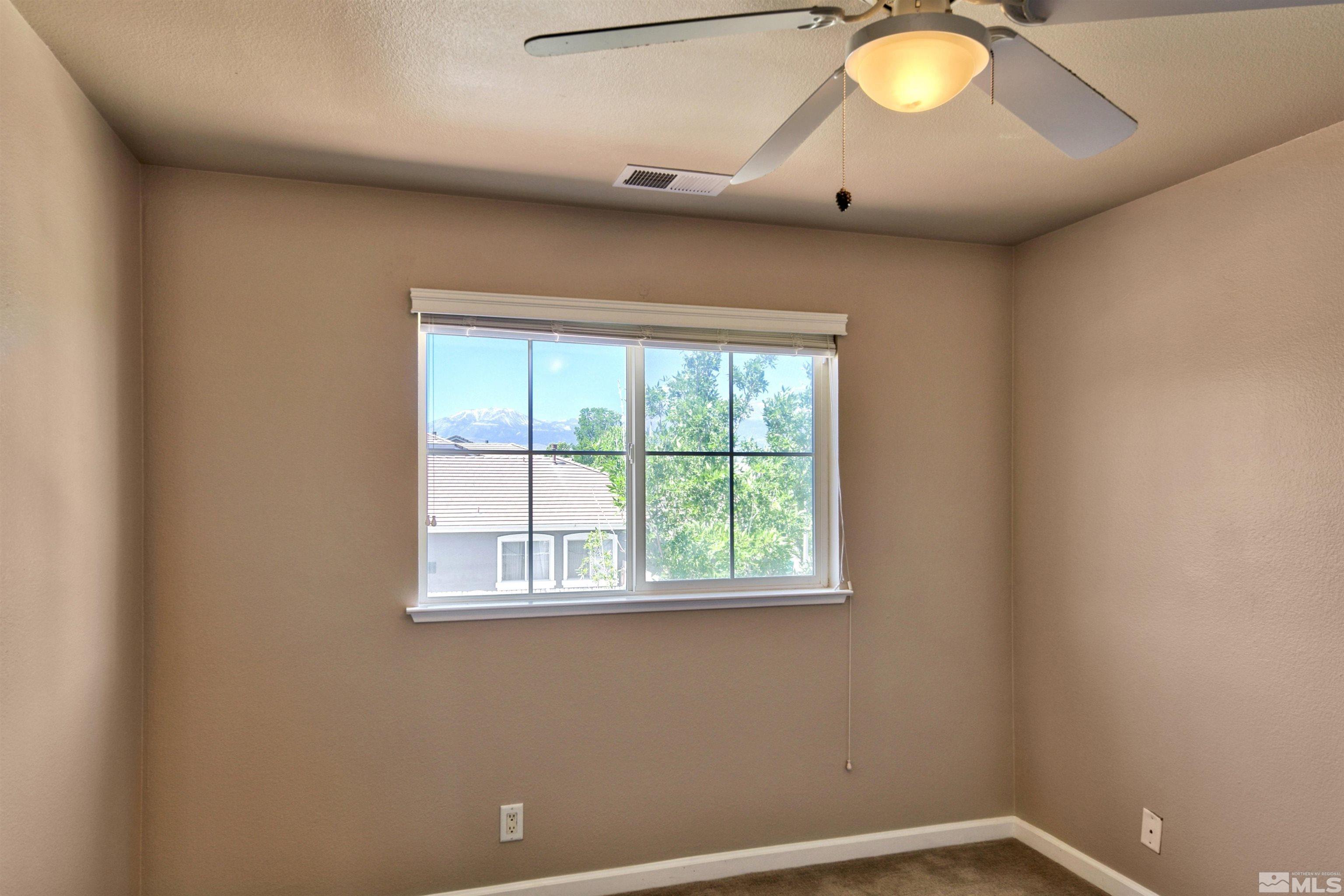 10084 Silver Star Drive Reno, NV 89521 - Photo 15 of 26 a view of a livingroom with a window
