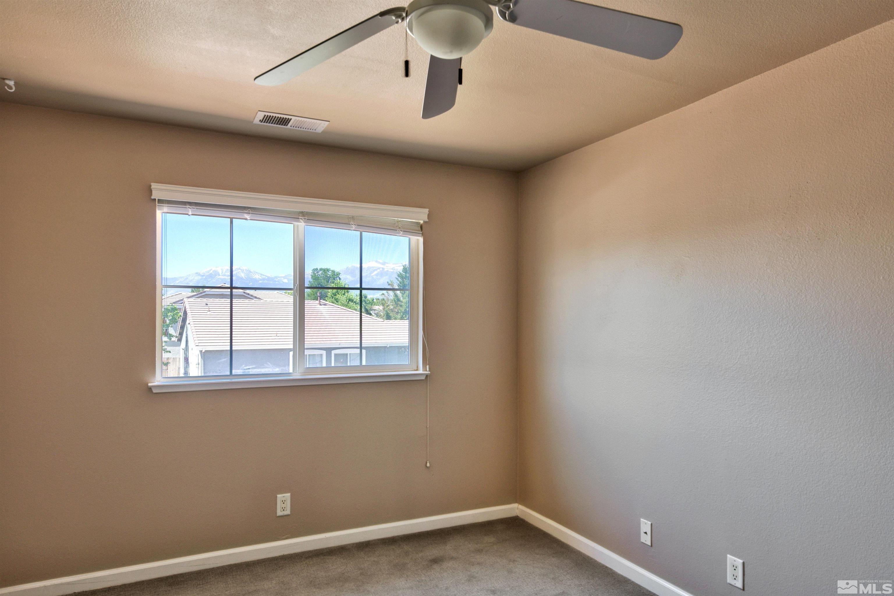 10084 Silver Star Drive Reno, NV 89521 - Photo 18 of 26 an empty room with a window