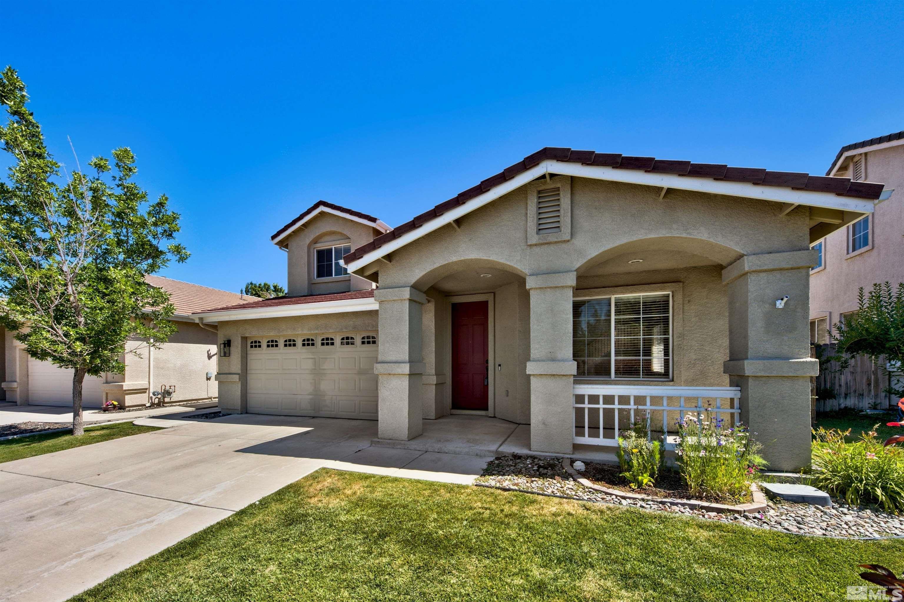 10084 Silver Star Drive Reno, NV 89521 - Photo 26 of 26 a front view of a house with garden