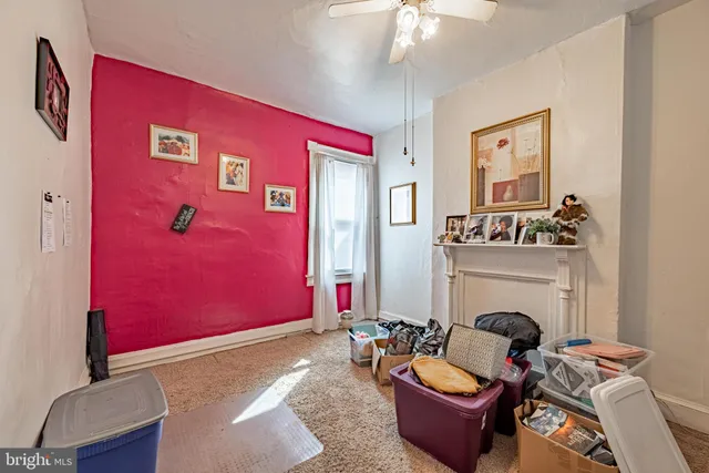 a room with furniture a air conditioner and a window