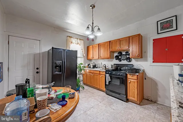 a kitchen with stainless steel appliances granite countertop a stove and a sink