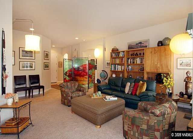 1550 Caughlin Creek Road Reno, NV 89519 - Photo 3 of 9 a living room with furniture and a flat screen tv