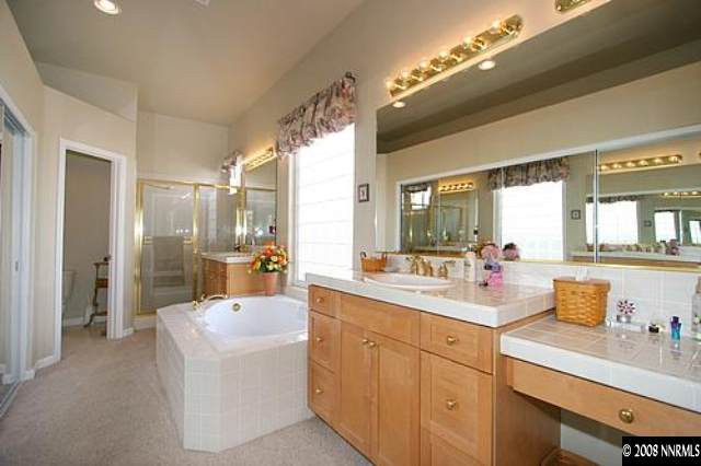 1550 Caughlin Creek Road Reno, NV 89519 - Photo 6 of 9 a large white kitchen with a lot of counter space and a sink