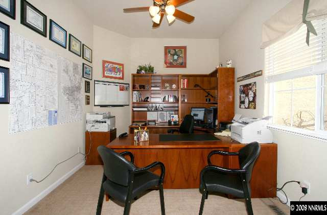 1550 Caughlin Creek Road Reno, NV 89519 - Photo 7 of 9 a living room with fireplace furniture and a window