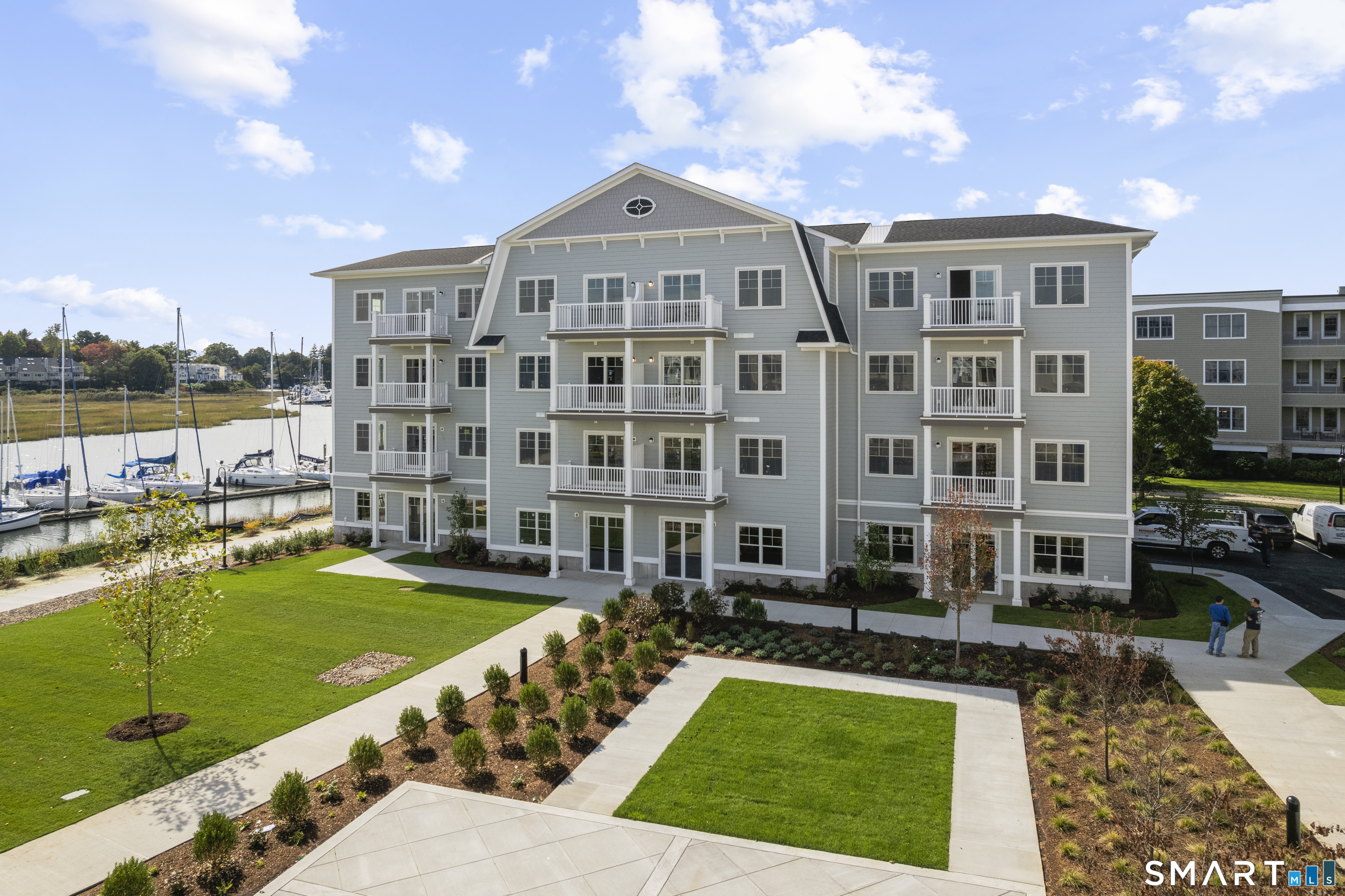 52 Maple Street, Unit 101 Branford, CT 06405 - Photo 14 of 18 a view of an apartment with a swimming pool and outdoor seating