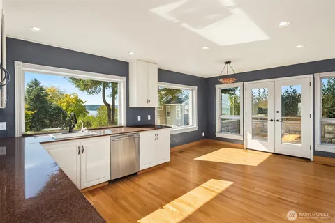 a large kitchen with lots of counter space and stainless steel appliances