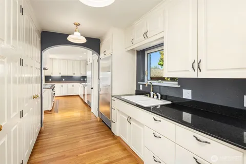a kitchen with stainless steel appliances granite countertop a stove and a refrigerator