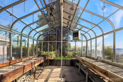 a view of front door with wooden floor and a window