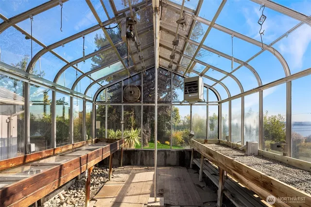 a view of front door with wooden floor and a window