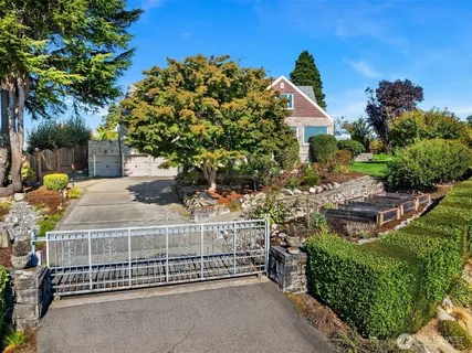 a view of a garden with a building in the background