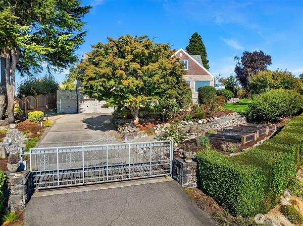 a view of a garden with a building in the background