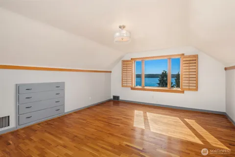 a view of a hallway with bathroom