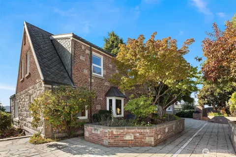 an aerial view of a house with a garden