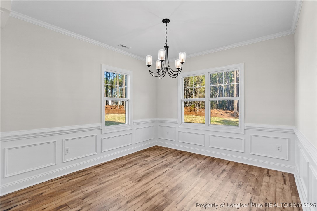 944 Rhum Drive Fayetteville, NC 28311 - Photo 11 of 49 wooden floor in an empty room with a window