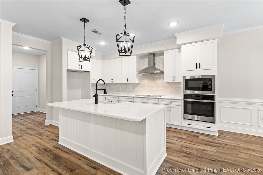 944 Rhum Drive Fayetteville, NC 28311 - Photo 13 of 49 a kitchen with a sink stainless steel appliances and cabinets
