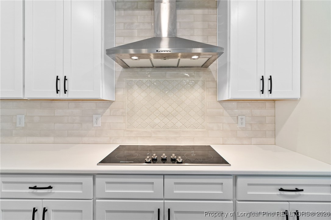 944 Rhum Drive Fayetteville, NC 28311 - Photo 15 of 49 a kitchen with white cabinets and appliances