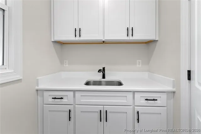 a kitchen with a sink and cabinets