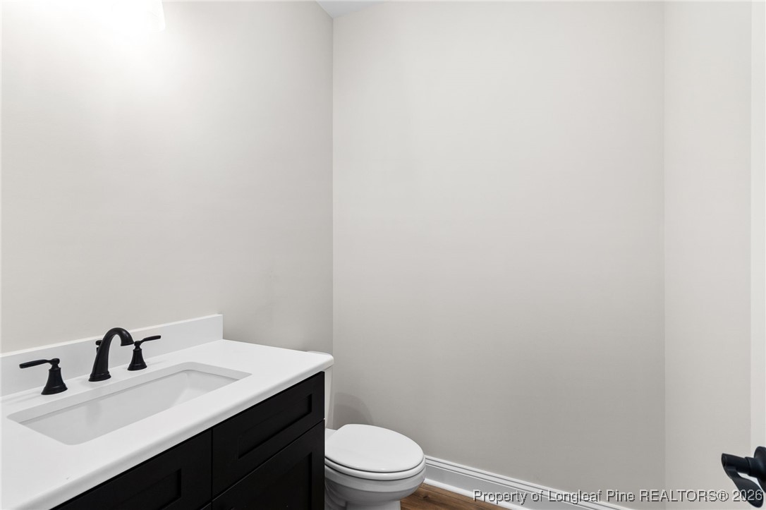 944 Rhum Drive Fayetteville, NC 28311 - Photo 22 of 49 a bathroom with a sink a toilet and a mirror