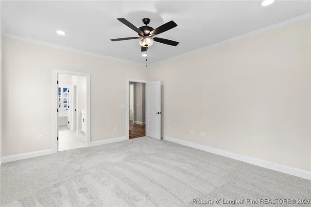 an empty room with ceiling fan and a ceiling fan
