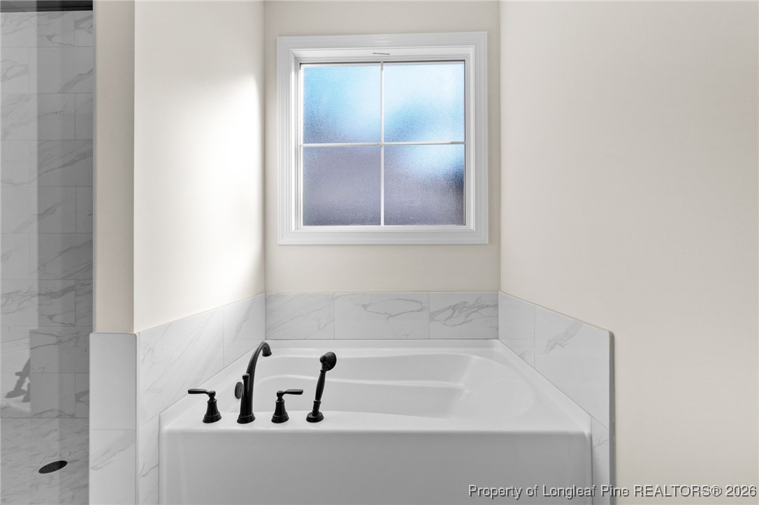 944 Rhum Drive Fayetteville, NC 28311 - Photo 27 of 49 a bathroom with a bathtub