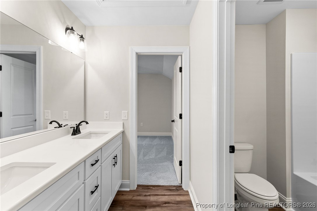 944 Rhum Drive Fayetteville, NC 28311 - Photo 32 of 49 a bathroom with a double vanity sink toilet and shower
