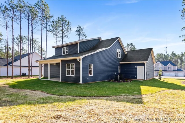 a view of a house with a big yard