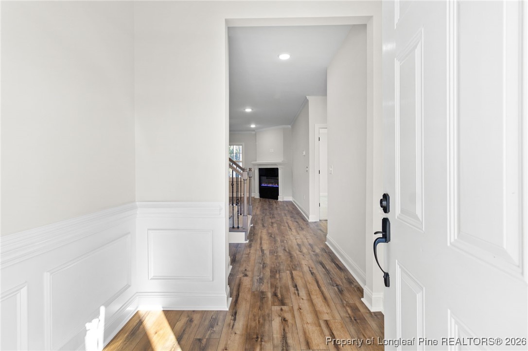 944 Rhum Drive Fayetteville, NC 28311 - Photo 6 of 49 a view of a hallway with wooden floor and staircase
