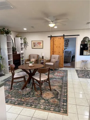 a living room with furniture and a rug