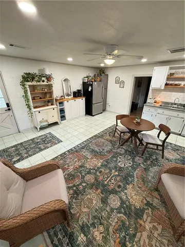a living room with furniture and a rug