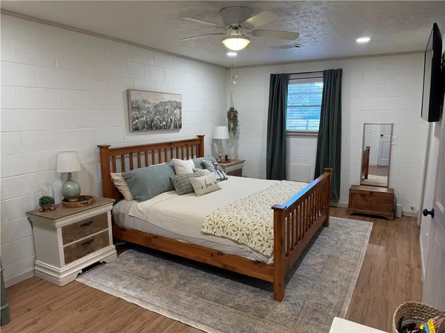 a bed room with a bed and a couch